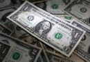 Dollar hovers near 2-month peak, Swiss Franc falls, Norwegian crown rises